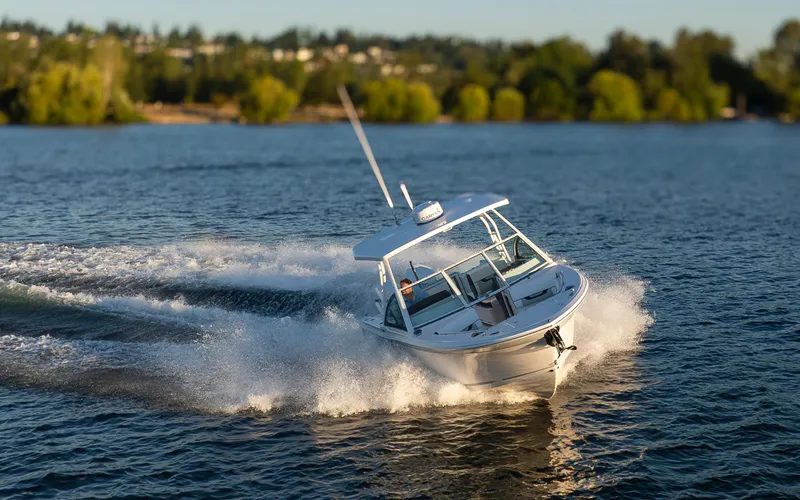  Yacht Photos Pics 2024 Blackfin 252 DC boat cruising on a scenic lake with lush green trees.