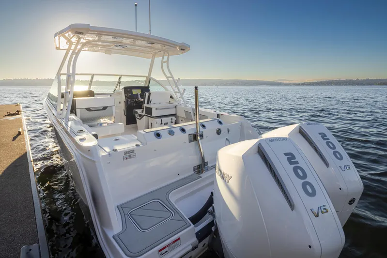  Yacht Photos Pics 2024 Blackfin 252 DC boat with twin 200 horsepower engines on a sunny day.