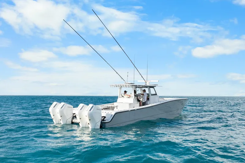  Yacht Photos Pics Modern Freeman 47 boat on open sea, 2099 model, under clear blue sky.