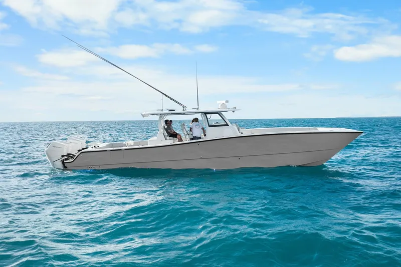  Yacht Photos Pics Freeman 47 boat cruising on open ocean under clear blue sky, year 2099.