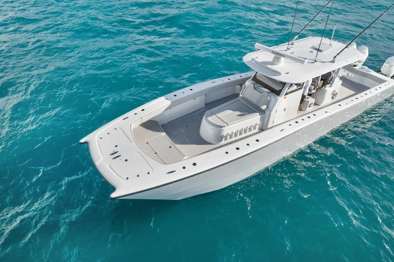  Yacht Photos Pics Aerial view of Freeman 47 boat cruising on clear blue ocean waters, year 2099 model.