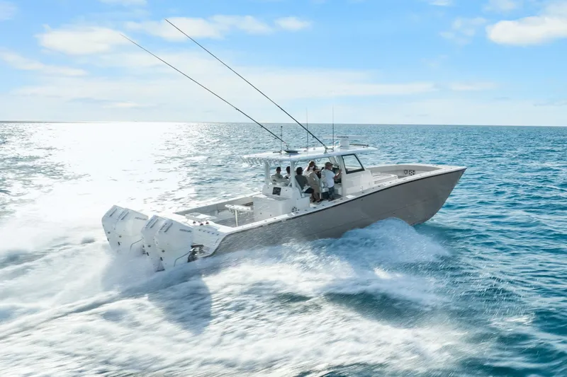  Yacht Photos Pics Freeman 47 boat cruising on open sea, 2099 model, under clear blue sky.