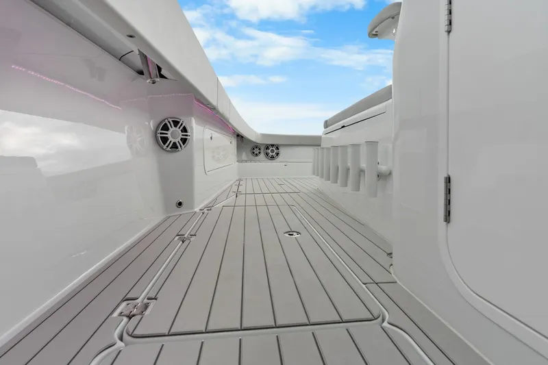  Yacht Photos Pics Sleek deck of Freeman 47 boat, 2099 model, featuring modern design and speakers.