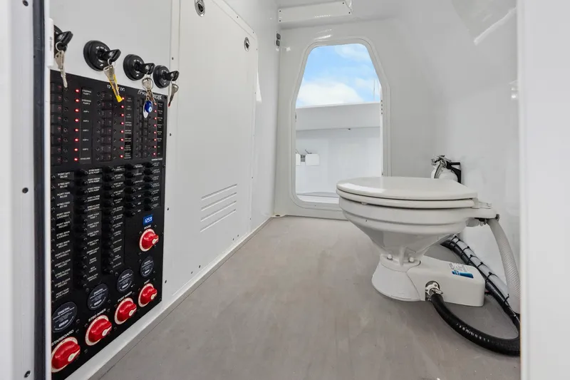  Yacht Photos Pics Interior of Freeman 47 (2099) boat with control panel and marine toilet.