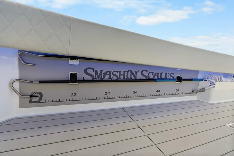  Yacht Photos Pics Fishing rod holder on Freeman 47 boat, featuring "Smashin' Scales" branding and measurement scale.