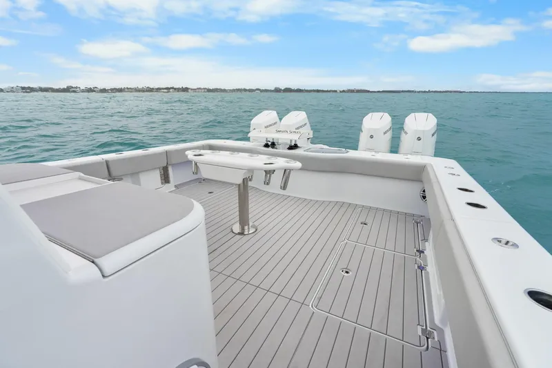  Yacht Photos Pics Freeman 47 boat deck with seating and engines, 2099 model, on open water.