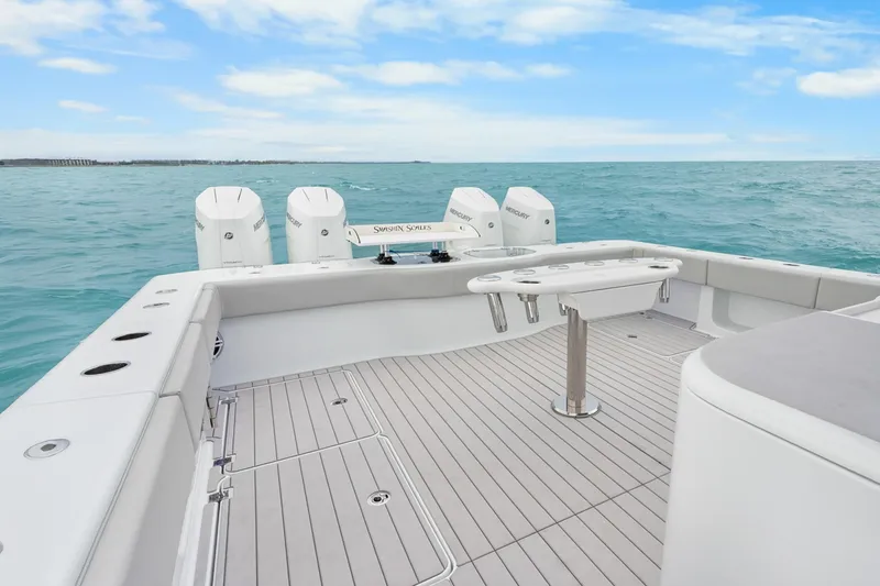  Yacht Photos Pics Freeman 47 boat deck with ocean view, featuring multiple outboard engines, year 2099.