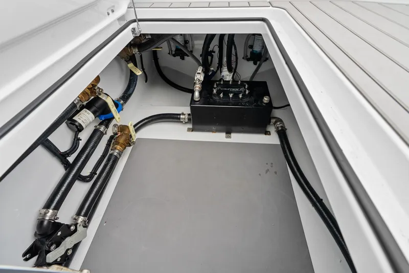  Yacht Photos Pics Freeman 47 boat compartment with hoses and mechanical components, year 2099.