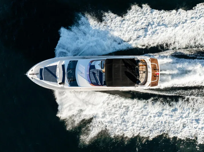Just For Fun Yacht Photos Pics Sunseeker Manhattan 73 yacht cruising on water, aerial view, 2011 model.