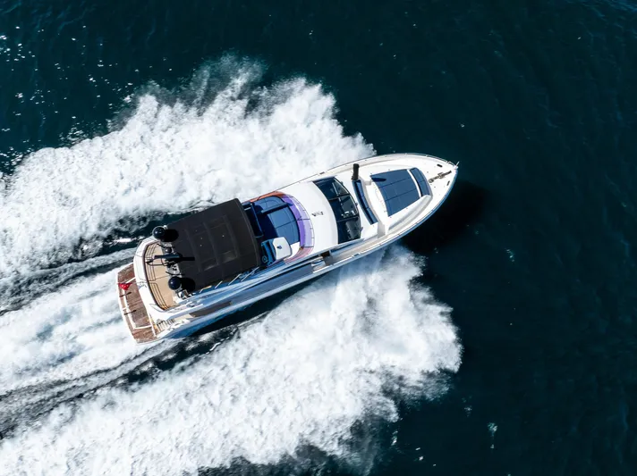 Just For Fun Yacht Photos Pics Aerial view of 2011 Sunseeker Manhattan 73 yacht cruising on open water.
