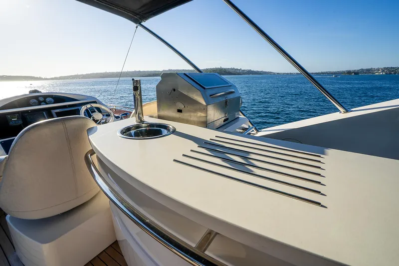 Just For Fun Yacht Photos Pics Luxurious Sunseeker Manhattan 73 yacht deck with ocean view, featuring sleek design and modern amenities.