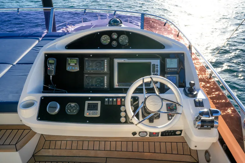 Just For Fun Yacht Photos Pics Helm of 2011 Sunseeker Manhattan 73 yacht with navigation instruments and steering wheel.