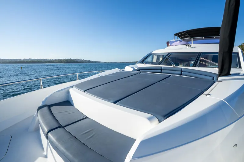 Just For Fun Yacht Photos Pics Sunseeker Manhattan 73 yacht, 2011 model, with sun deck, cruising on open water.