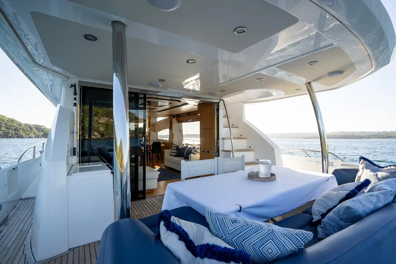 Just For Fun Yacht Photos Pics Luxurious Sunseeker Manhattan 73 yacht interior, featuring elegant seating and dining area, 2011 model.