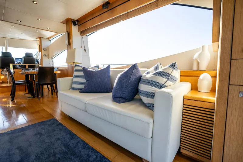 Just For Fun Yacht Photos Pics Luxurious interior of 2011 Sunseeker Manhattan 73 yacht with elegant seating and decor.