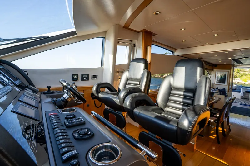 Just For Fun Yacht Photos Pics Luxurious Sunseeker Manhattan 73 yacht interior with sleek black captain chairs, 2011 model.