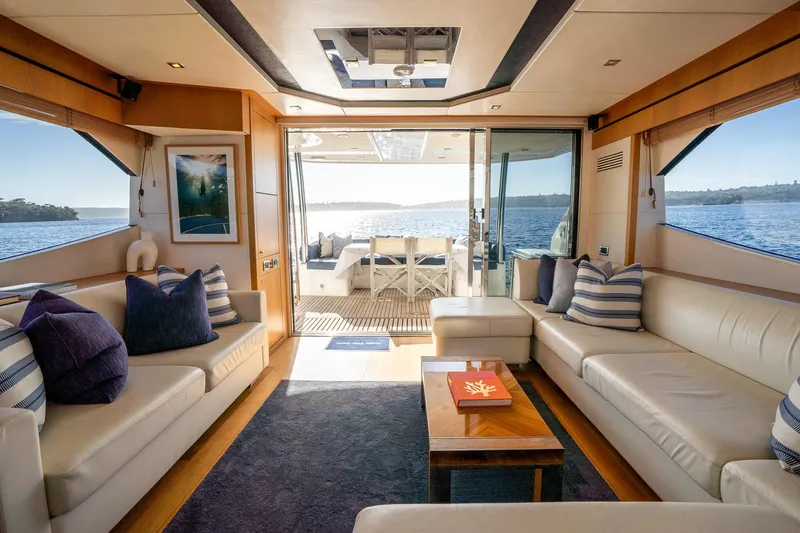 Just For Fun Yacht Photos Pics Luxurious interior of 2011 Sunseeker Manhattan 73 yacht with elegant seating and ocean view.