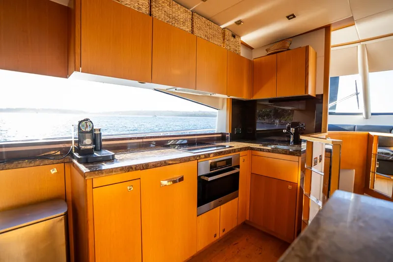 Just For Fun Yacht Photos Pics Luxurious kitchen interior of 2011 Sunseeker Manhattan 73 yacht with ocean view.