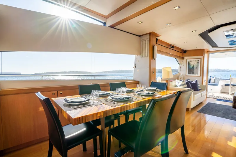 Just For Fun Yacht Photos Pics Luxurious Sunseeker Manhattan 73 yacht interior dining area with ocean view, 2011 model.