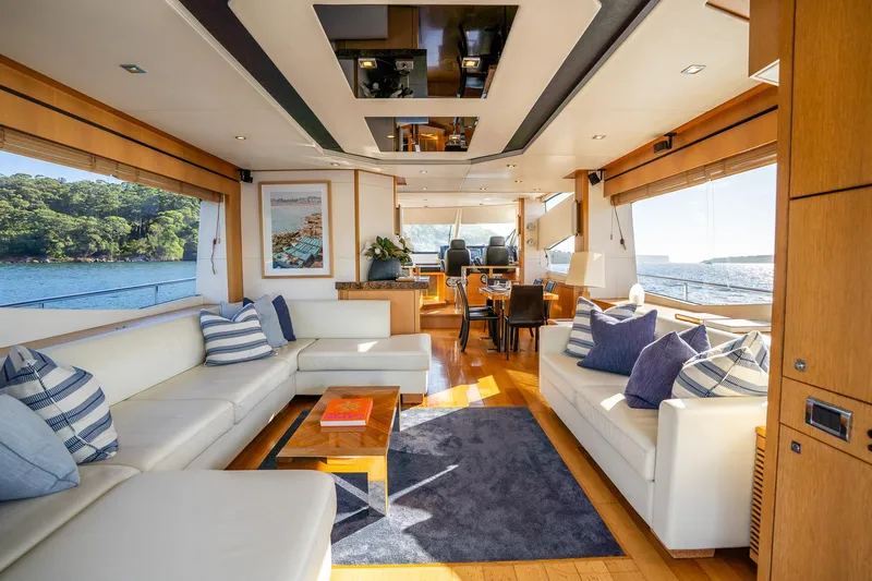 Just For Fun Yacht Photos Pics Luxurious interior of 2011 Sunseeker Manhattan 73 yacht with elegant seating and scenic ocean views.