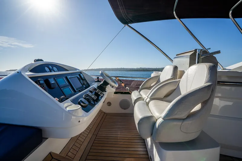 Just For Fun Yacht Photos Pics Luxurious Sunseeker Manhattan 73 yacht helm with leather seats and ocean view, 2011 model.