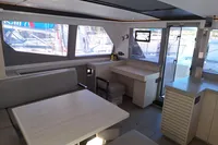 Modern interior of 2019 Leopard 45 catamaran with spacious seating and large windows.