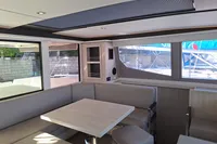 Interior of 2019 Leopard 45 catamaran with modern seating and dining area.