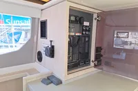 Control panel inside 2019 Leopard 45 catamaran, featuring navigation and communication equipment.