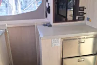 Modern kitchen area in a 2019 Leopard 45 catamaran with stainless steel appliances.