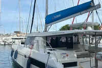 2019 Leopard 45 catamaran docked in marina, featuring sleek design and blue sail cover.