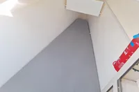 Compact cabin space in a 2019 Leopard 45 yacht with a fire extinguisher.