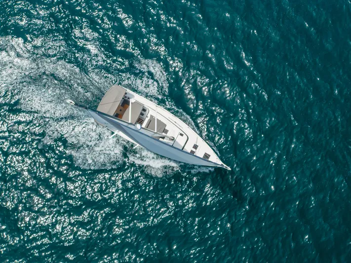 Kalesma Yacht Photos Pics Aerial view of 2021 Bavaria C50 Style yacht sailing on blue ocean waters.