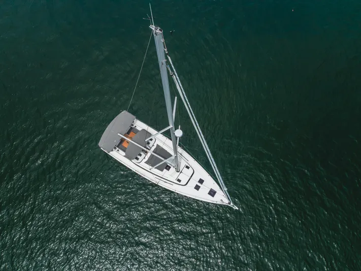 Kalesma Yacht Photos Pics Aerial view of 2021 Bavaria C50 Style sailboat on calm water.