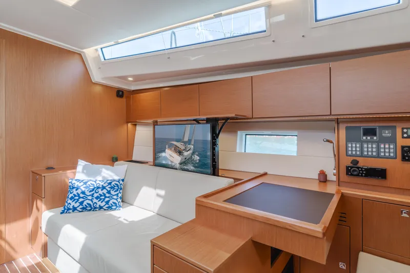 Kalesma Yacht Photos Pics Interior of 2021 Bavaria C50 Style yacht with modern wood finish and comfortable seating.