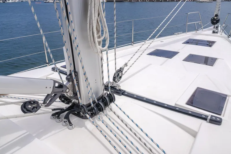Kalesma Yacht Photos Pics 2021 Bavaria C50 Style yacht deck with rigging and hatches, docked at marina.
