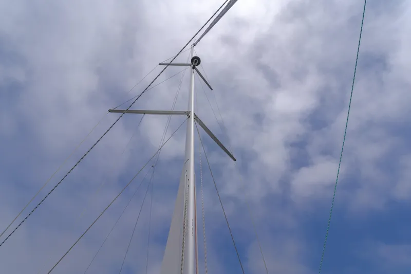 Kalesma Yacht Photos Pics Sailboat mast of 2021 Bavaria C50 Style against cloudy sky.