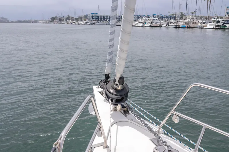 Kalesma Yacht Photos Pics Sailing yacht Bavaria C50 Style 2021 on calm waters near a marina.