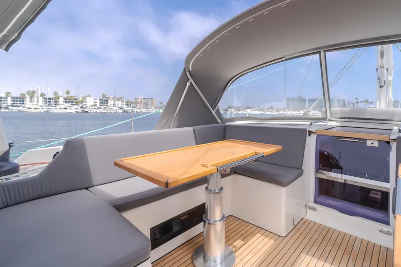 Kalesma Yacht Photos Pics Luxurious 2021 Bavaria C50 Style yacht interior with elegant seating and wooden table.
