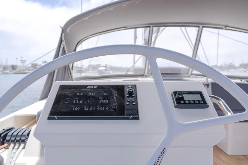 Kalesma Yacht Photos Pics 2021 Bavaria C50 Style yacht helm with navigation display and controls.