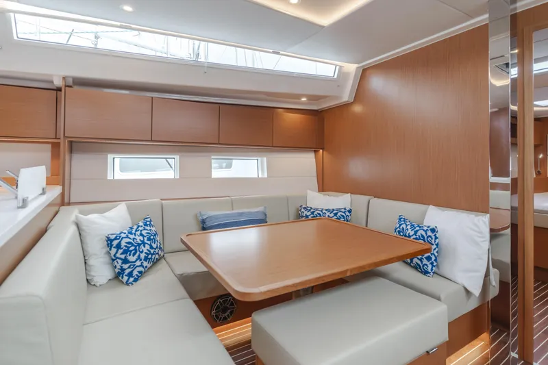 Kalesma Yacht Photos Pics Luxurious interior of 2021 Bavaria C50 Style yacht with elegant seating and wooden finishes.