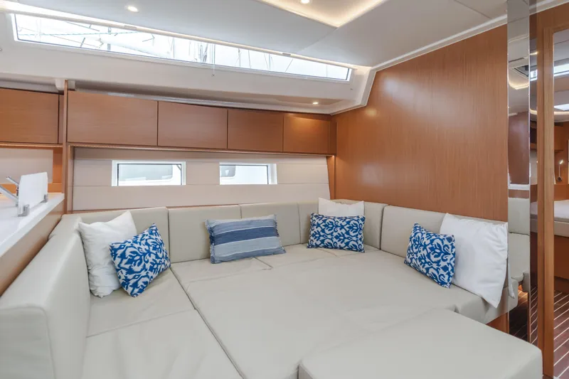 Kalesma Yacht Photos Pics Luxurious interior of 2021 Bavaria C50 Style yacht with plush seating and decorative pillows.