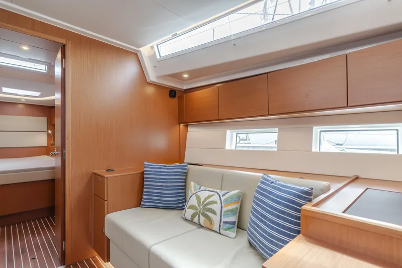 Kalesma Yacht Photos Pics Interior of 2021 Bavaria C50 Style yacht with modern seating and decorative pillows.