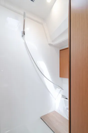 Kalesma Yacht Photos Pics Modern bathroom interior in 2021 Bavaria C50 Style yacht, featuring sleek design and wooden accents.