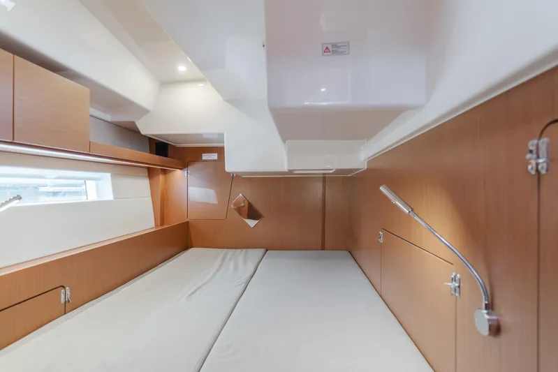 Kalesma Yacht Photos Pics Interior cabin of 2021 Bavaria C50 Style yacht, featuring modern wood paneling and sleek design.