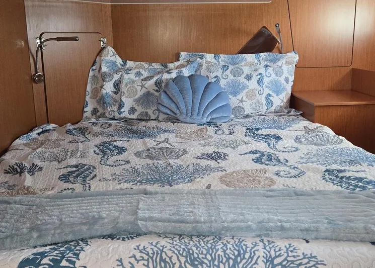 Kalesma Yacht Photos Pics Cozy bedroom in 2021 Bavaria C50 Style yacht with ocean-themed bedding.