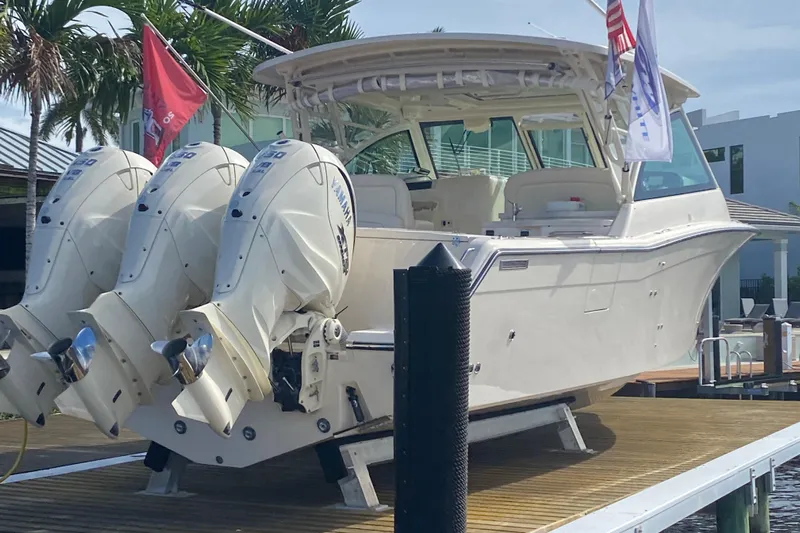  Yacht Photos Pics 2024 Grady-White Freedom 375 boat with triple Yamaha engines docked.