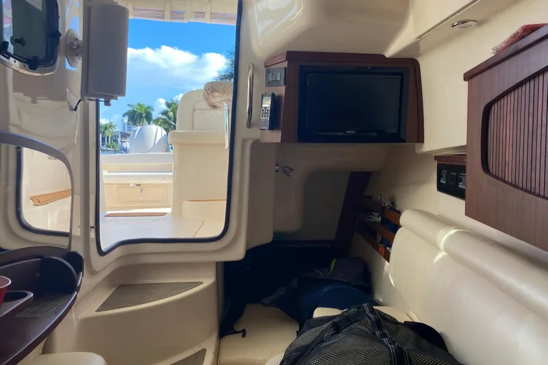  Yacht Photos Pics Interior of 2024 Grady-White Freedom 375 boat with seating and TV.