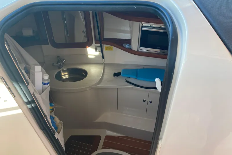  Yacht Photos Pics 2024 Grady-White Freedom 375 boat interior with sink and storage.