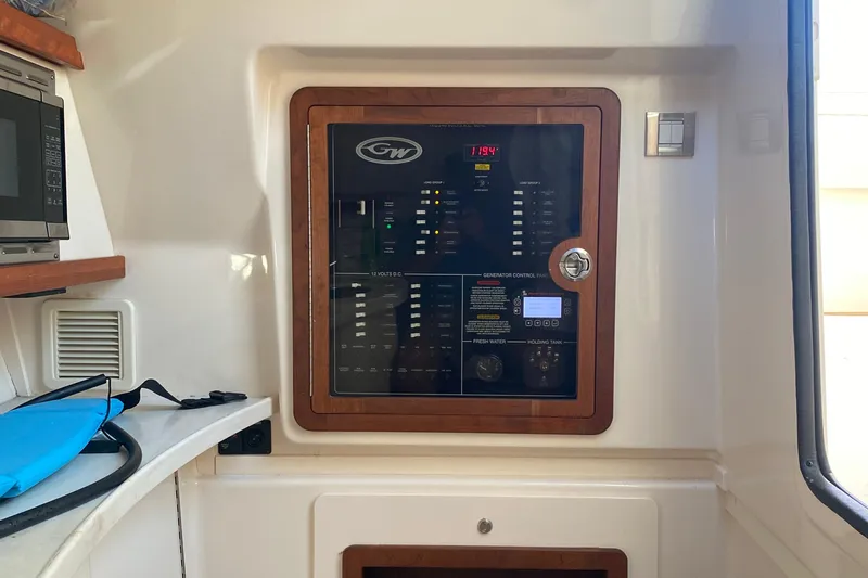  Yacht Photos Pics 2024 Grady-White Freedom 375 control panel with microwave and storage area.