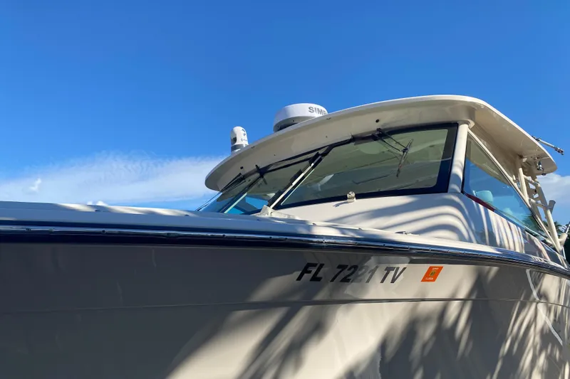  Yacht Photos Pics 2024 Grady-White Freedom 375 boat under clear blue sky.